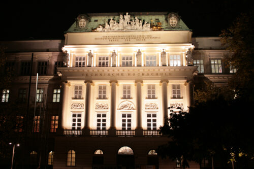 An historical building at night illuminated with light