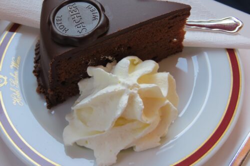 a pice of choclate cake with cream